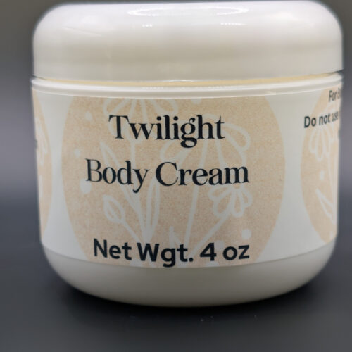 White jar on black background with "Twilight Body Cream Net Wgt 4.0 oz" Written on the jar